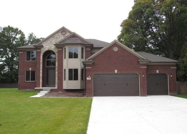 view of front facade featuring a front lawn and a garage