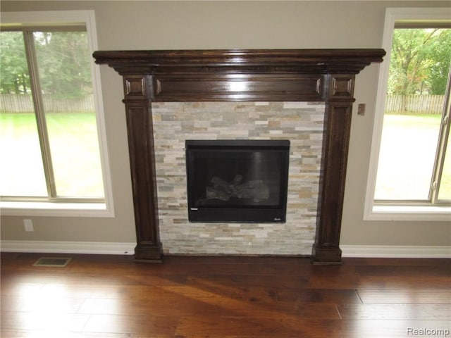 72859 Sorrel Dr, Bruce, MI 48065 - detailed view of baseboards, wood finished floors, and decorative columns