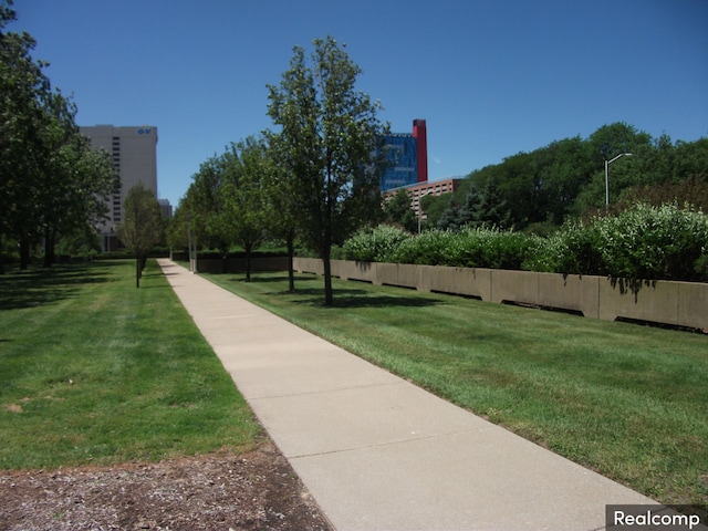 view of property's community featuring a yard