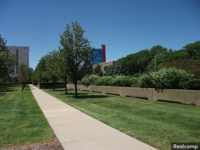 view of home's community with a yard