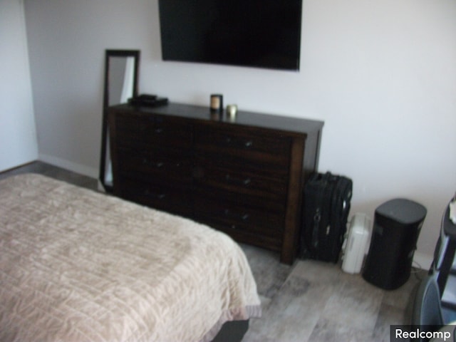 bedroom with light wood-type flooring