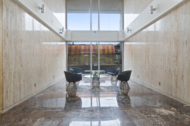 unfurnished living room with a high ceiling