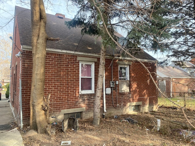16062 Carlisle St, Detroit, MI 48205 - view of side of property with roof with shingles and brick siding