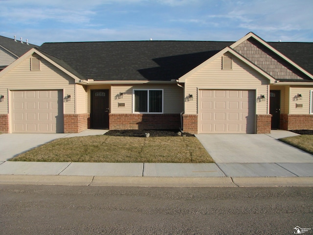 view of front facade with a front lawn and a garage