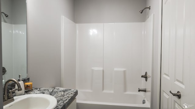 bathroom with shower / tub combination and sink