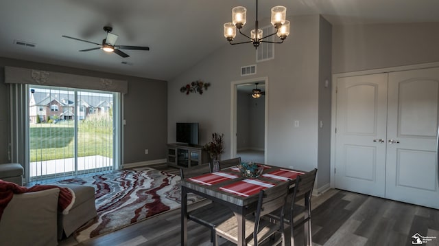 dining area with dark hardwood / wood-style flooring, ceiling fan with notable chandelier, and lofted ceiling