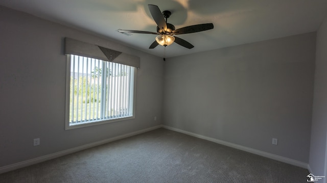 spare room with carpet floors and ceiling fan