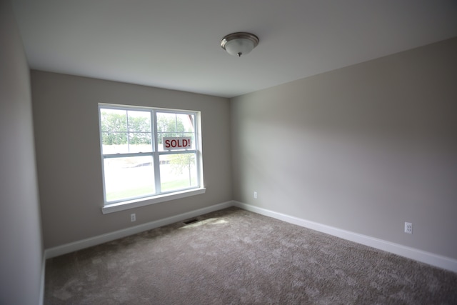 view of carpeted spare room