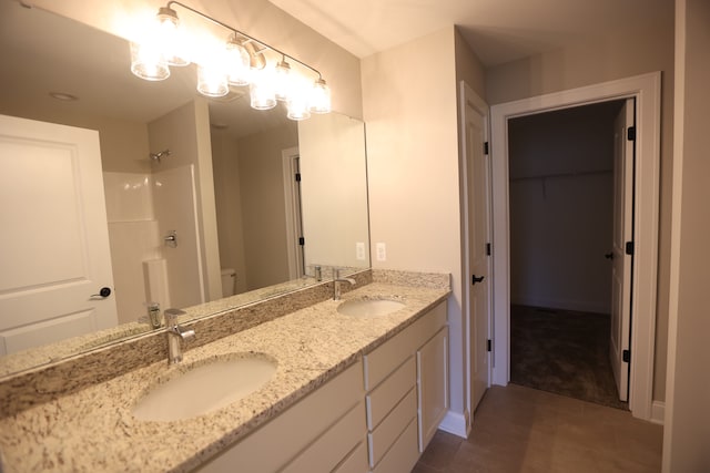 bathroom featuring vanity and walk in shower