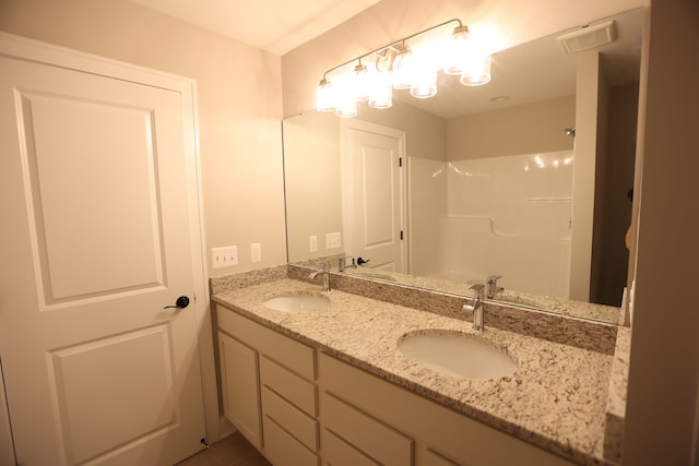 bathroom with vanity and walk in shower