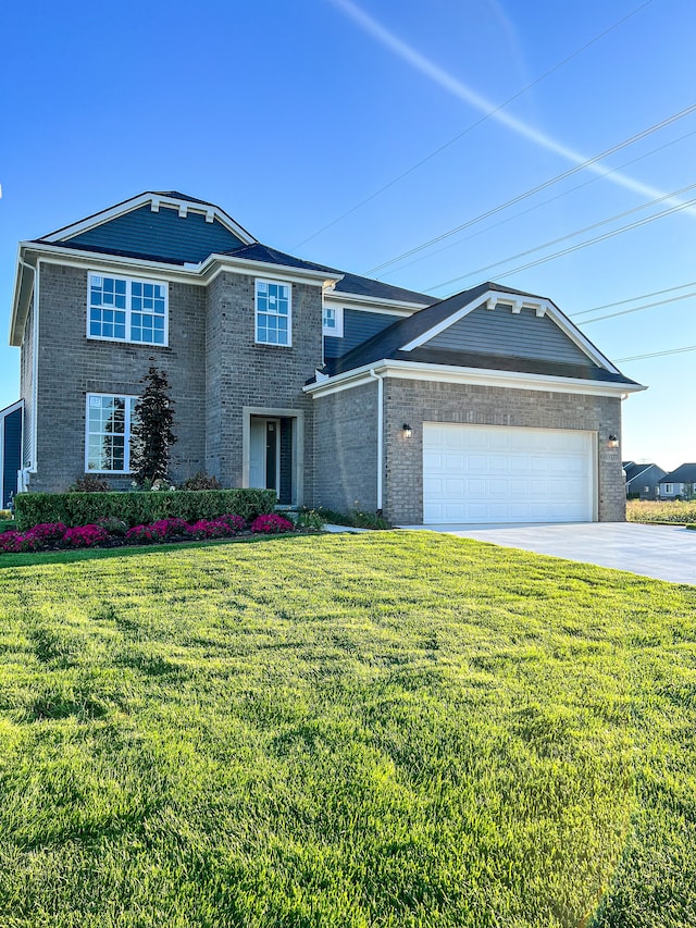 view of front of property featuring a garage and a front lawn