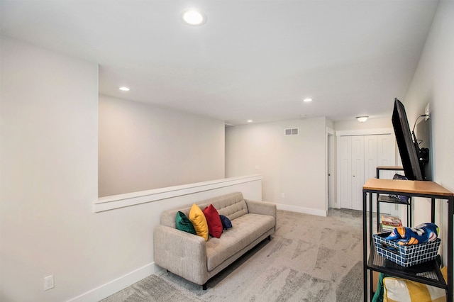 living area featuring light colored carpet