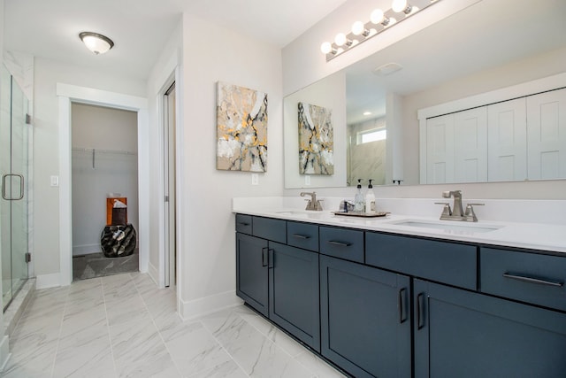 bathroom featuring vanity and a shower with shower door