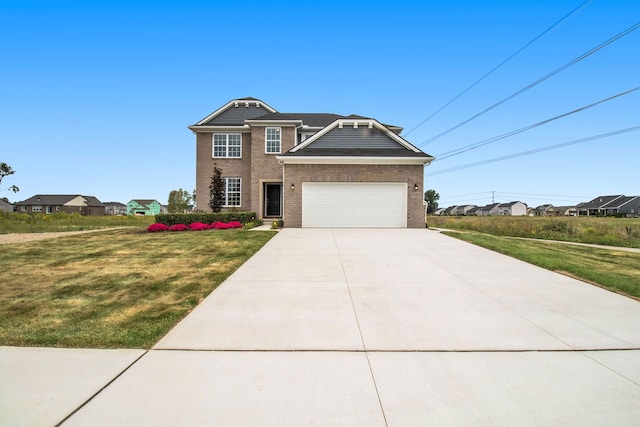 view of front facade featuring a front yard and a garage