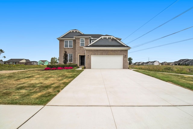 13327 Demil Dr, Romeo, MI 48065 - view of front facade with a front lawn, brick siding, driveway, and a garage