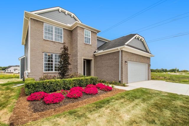 13327 Demil Dr, Romeo, MI 48065 - traditional-style house with brick siding, a garage, driveway, and a front lawn