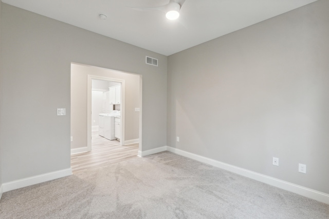 unfurnished room with light carpet and ceiling fan