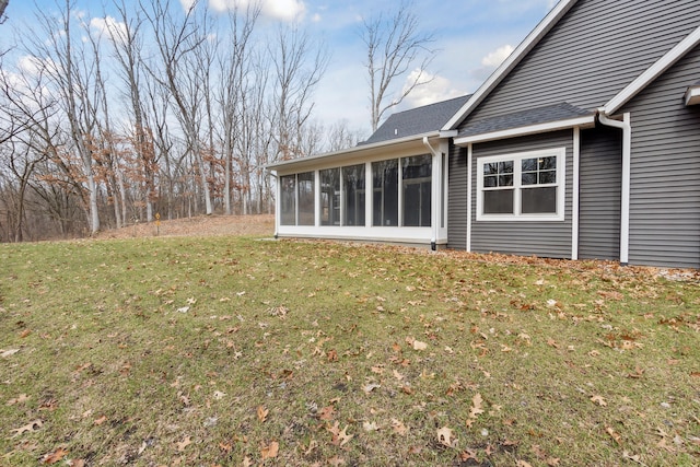 view of yard with a sunroom