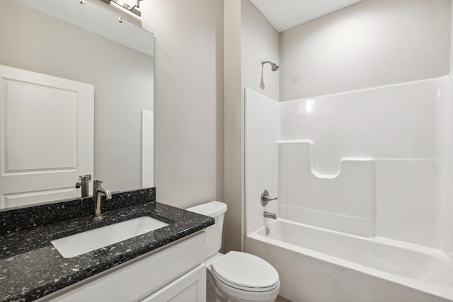 full bathroom featuring vanity,  shower combination, and toilet