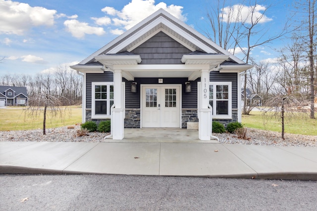 1140 Lochaven Cir Unit 10B, Hillsdale, MI 49242 - view of front of home with stone siding and covered porch