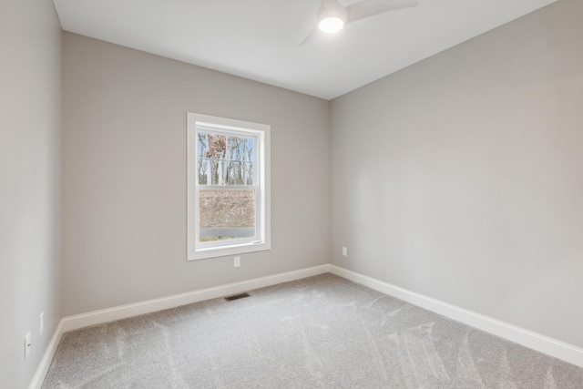1140 Lochaven Cir Unit 10B, Hillsdale, MI 49242 - spare room with carpet, baseboards, and ceiling fan