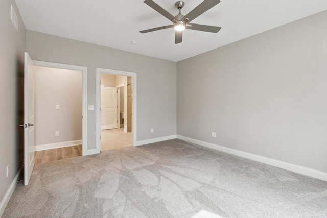 1140 Lochaven Cir Unit 10B, Hillsdale, MI 49242 - unfurnished bedroom featuring carpet floors, baseboards, and ceiling fan