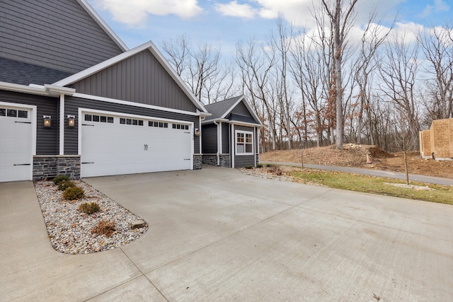 view of side of home featuring a garage