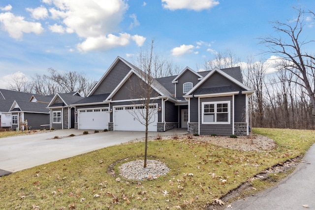 craftsman-style house with a garage and a front lawn