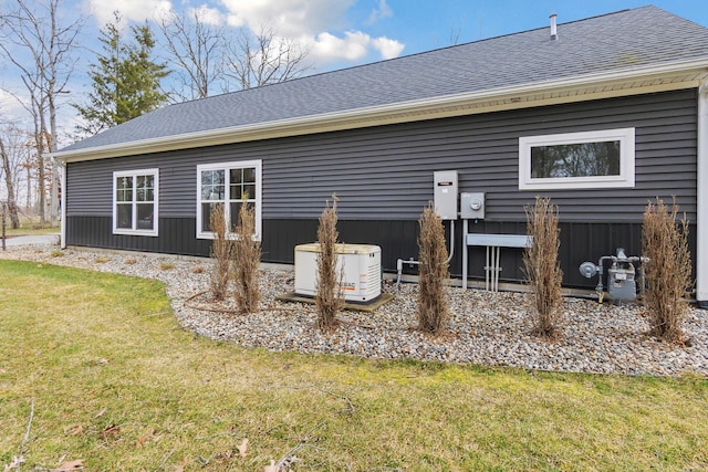 rear view of house with a yard