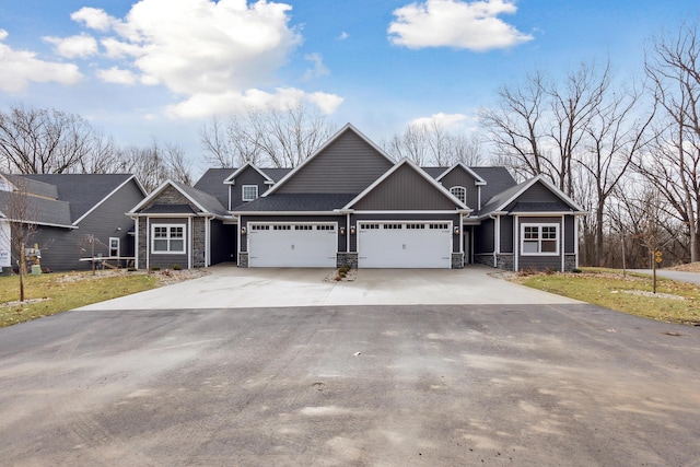 1140 Lochaven Cir Unit 10B, Hillsdale, MI 49242 - craftsman-style home with stone siding, driveway, and an attached garage