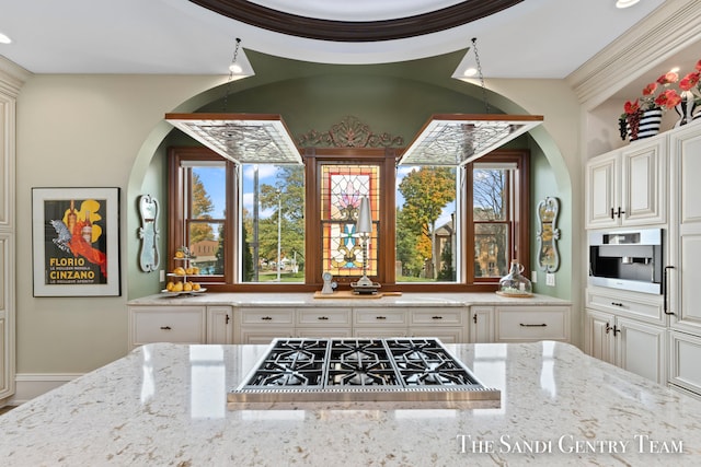 kitchen featuring stainless steel appliances and light stone counters