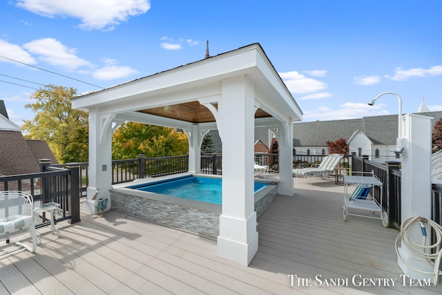 view of pool with a wooden deck