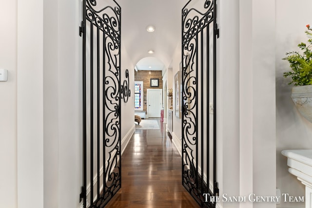 hall with dark wood-type flooring