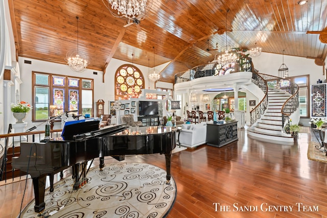 misc room with hardwood / wood-style floors, high vaulted ceiling, wooden ceiling, and a notable chandelier