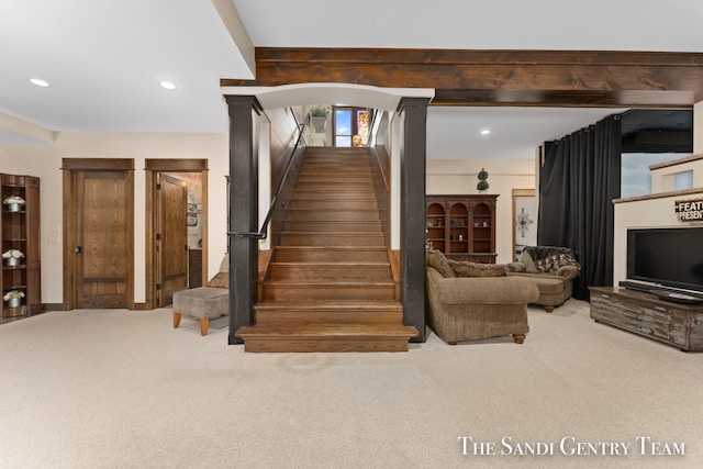 stairs featuring carpet floors