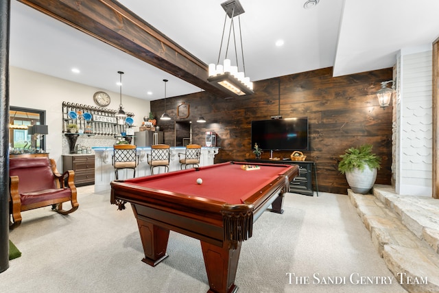 recreation room with light carpet, indoor bar, wood walls, and billiards