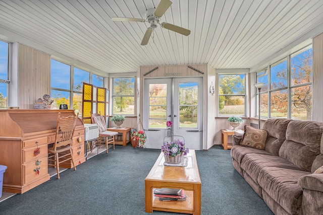 sunroom / solarium featuring ceiling fan