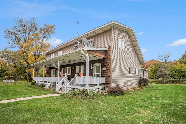 view of front of house featuring covered porch and a front yard