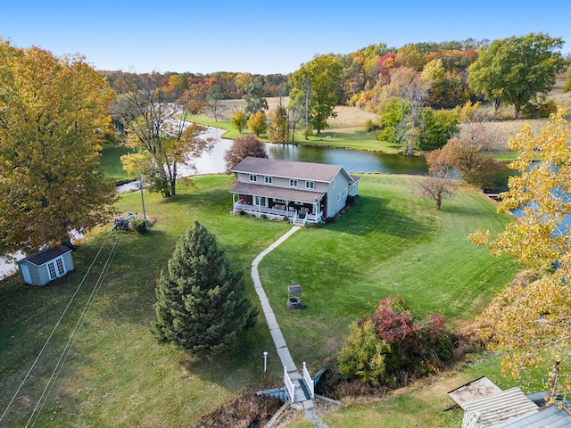 birds eye view of property featuring a water view