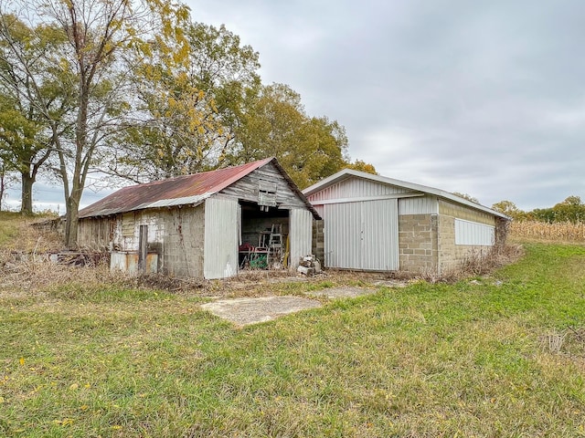 view of outbuilding with a yard