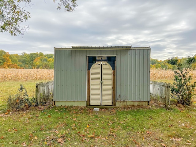 view of outbuilding with a lawn