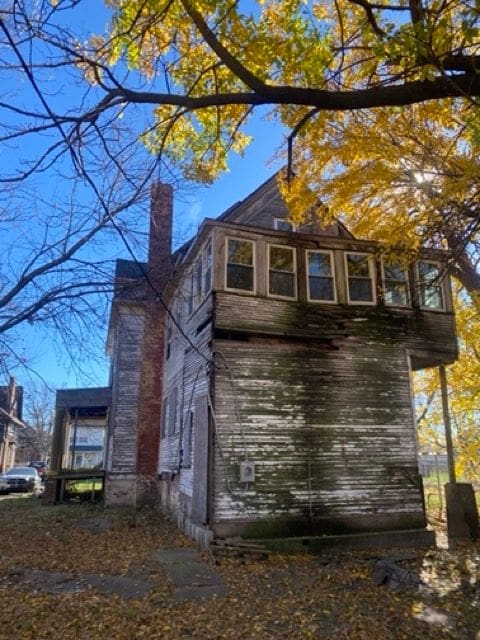 100 Pingree St, Detroit, MI 48202 - view of home's exterior with a chimney