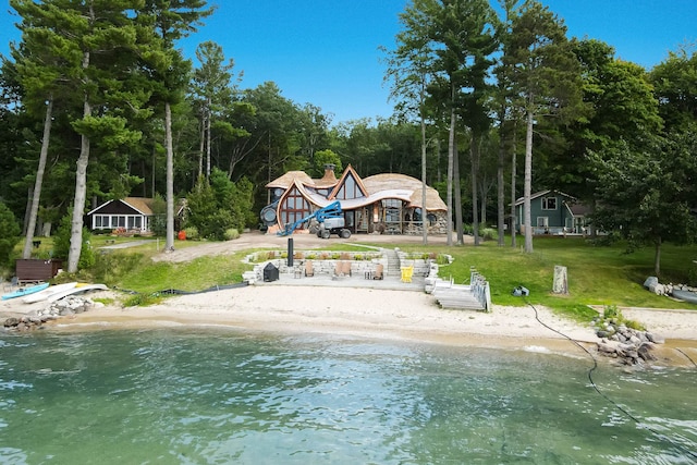 9554 Fowler Ln, Rapid City, MI 49676 - dock featuring a yard and a water view