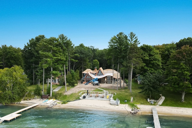 9554 Fowler Ln, Rapid City, MI 49676 - drone / aerial view of a heavily wooded area and a large body of water