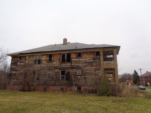 view of home's exterior with a yard