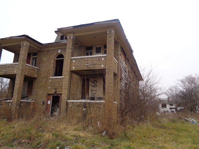 3758 Rochester St, Detroit, MI 48206 - view of front of house with a balcony and brick siding