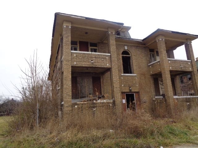 3758 Rochester St, Detroit, MI 48206 - rear view of house featuring a balcony and brick siding