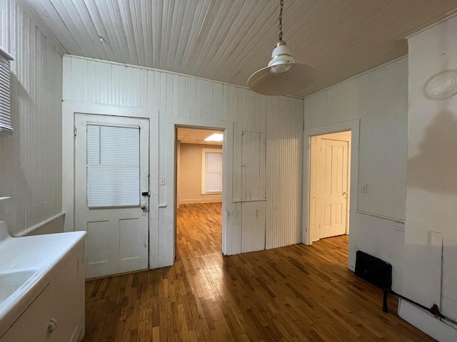 415 S Franklin, Mount Pleasant, MI 48858 - unfurnished dining area with wood finished floors, wood walls, and ceiling fan