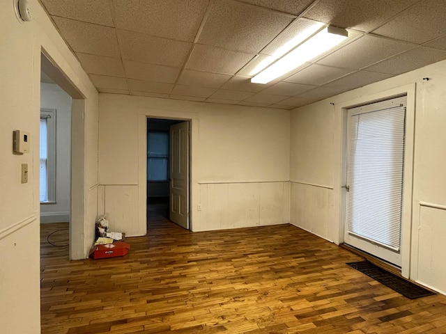 415 S Franklin, Mount Pleasant, MI 48858 - unfurnished room featuring wood finished floors and a drop ceiling