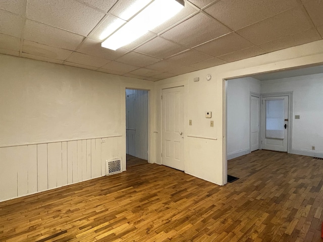 415 S Franklin, Mount Pleasant, MI 48858 - unfurnished room featuring wood finished floors and a drop ceiling